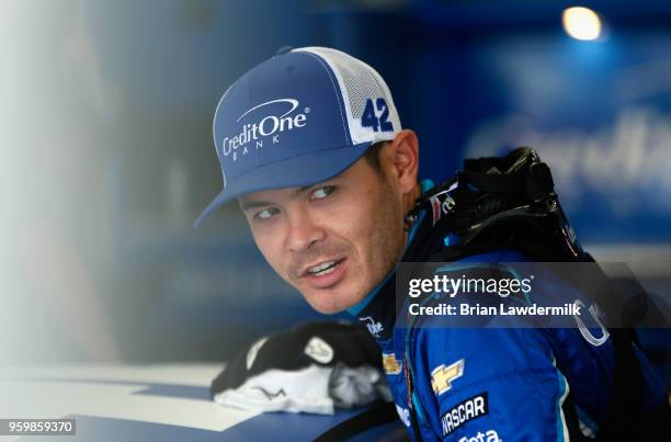 Kyle Larson, driver of the Credit One Bank Chevrolet, stands in the garage during practice for the Monster Energy NASCAR Cup Series All-Star Race at...