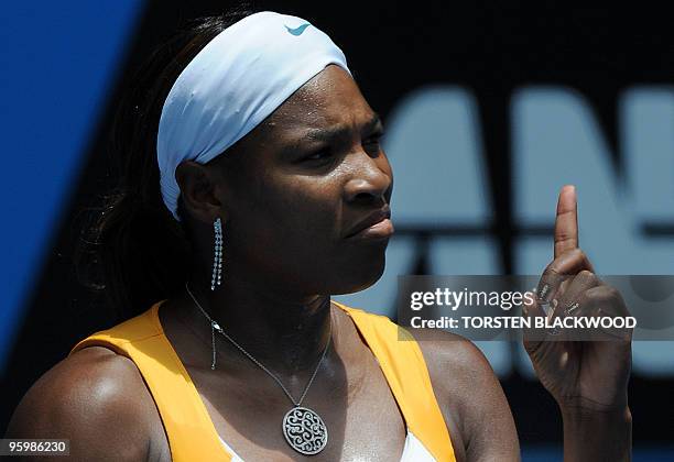 Tennis player Serena Williams gestures during her third round women's singles match against Spanish opponent Carla Suarez Navarro at the Australian...