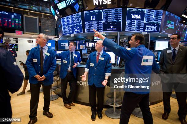 Traders work on the floor of the New York Stock Exchange in New York, U.S., on Friday, May 18, 2018. U.S. Stocks fluctuated, the dollar rose and...