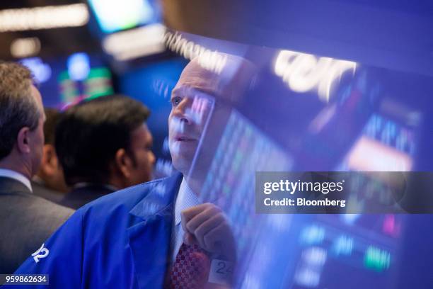 Trader works on the floor of the New York Stock Exchange in New York, U.S., on Friday, May 18, 2018. U.S. Stocks fluctuated, the dollar rose and...