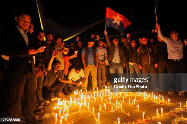Young Communist League, the youth wing of Communist Party of Nepal lits candle outside the city hall as after leaders jointly signed the agreement...