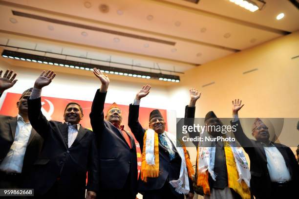 Prime Minister KP Oli and CPN Chair Pushpa Kamal Dahal and leaders wave their hand as after jointly signed the agreement during the unification...