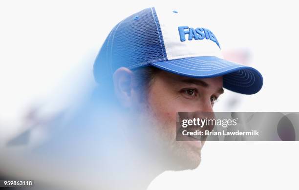 Ricky Stenhouse Jr., driver of the Fastenal Ford, stands in the garage area during practice for the Monster Energy NASCAR Cup Series All-Star Race at...