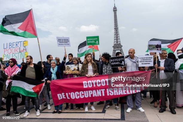 Demonstrators participate in a rally in support of Palestine, in front of the Eiffel Tower in Trocadero, on May 16, 2018 in Paris, France. Two days...