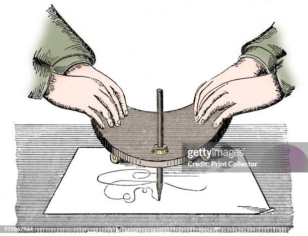 Planchette or Ouija board, circa 1880. Method of using the Planchette for spirit writing during a séance. From The Practical Dictionary of Mechanics,...