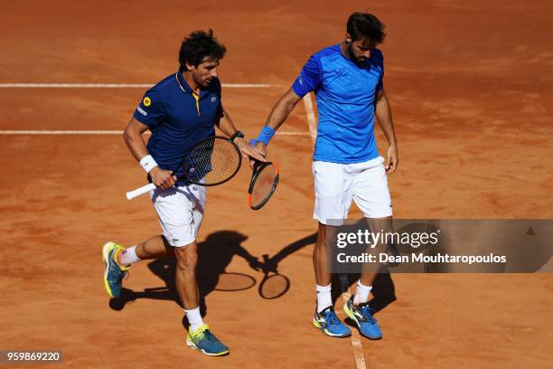 Pablo Cuevas of Uraguay and Marcel Granollers of Spain compete in their quarter final match against Oliver Marach of Austria and Mate Pavic of...