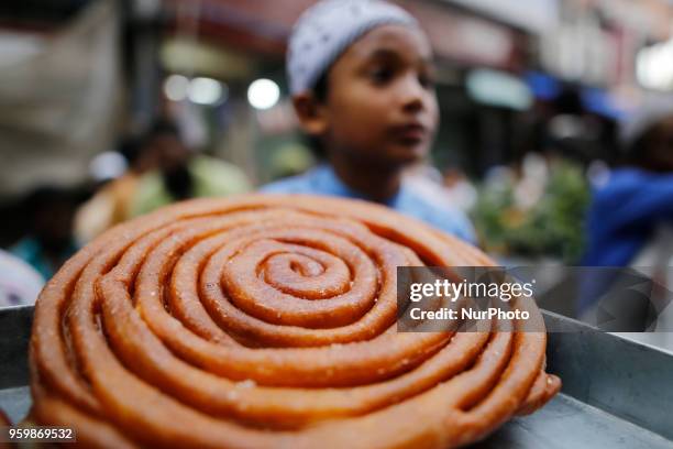 Traditional iftar items on sale at makeshift shop at chawkbazar in Old part of Dhaka, Bangladesh on May 18, 2018. Dhakas residents gathered at the...