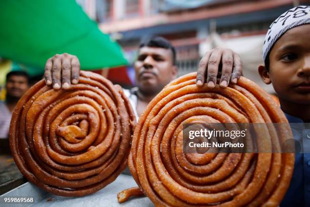 Traditional iftar items on sale at makeshift shop at chawkbazar in Old part of Dhaka, Bangladesh on May 18, 2018. Dhakas residents gathered at the...