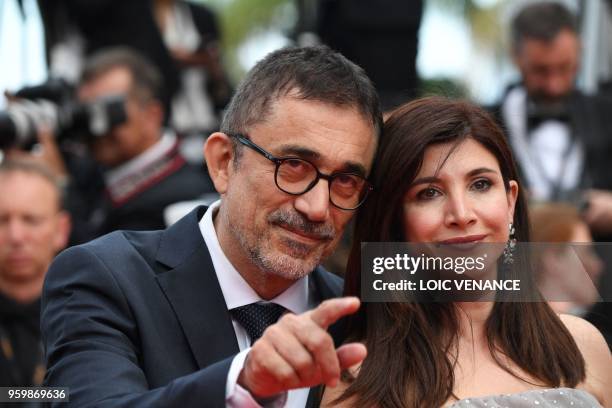 Turkish actress Ebru Ceylan and her husband Turkish director Nuri Bilge Ceylan pose as they arrive on May 18, 2018 for the screening of the film "The...