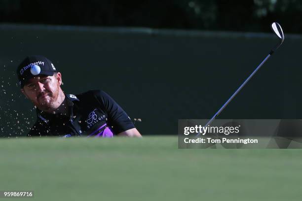 Jimmy Walker plays a shot from a bunker on the 13th hole during the second round of the AT&T Byron Nelson at Trinity Forest Golf Club on May 18, 2018...