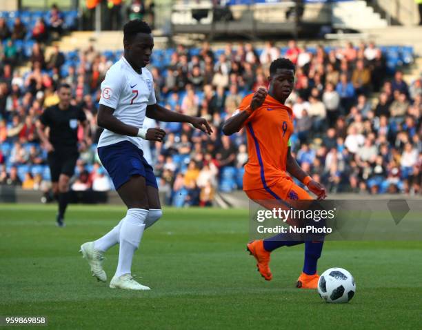 Arvin Appiah of England Under 17 and Daishawn Redan of Netherlands Under 17 during the UEFA Under-17 Championship Semi-Final match between England...