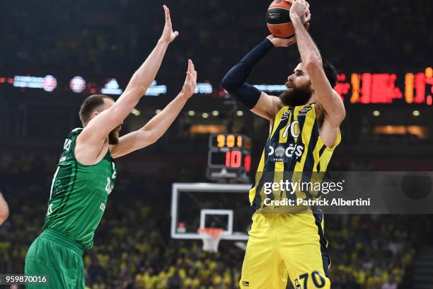 Luigi Datome, #70 of Fenerbahce Dogus Istanbul competes with Arturas Milaknis, #21 of Zalgiris Kaunas during the 2018 Turkish Airlines EuroLeague F4...