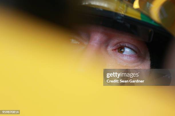 Kyle Busch, driver of the M&M's Red Nose Day Toyota, sits in his car during practice for the Monster Energy NASCAR Cup Series All-Star Race at...