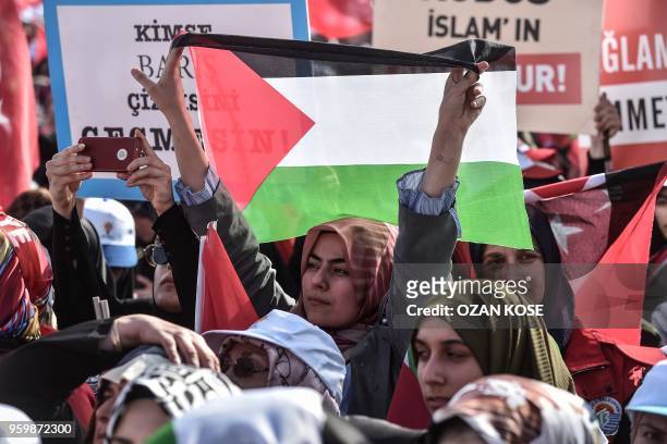 Protester holds the Palestinian flag during a protest rally in Istanbul on May 18 against the recent killings of Palestinian protesters on the...