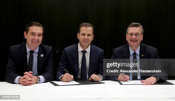 German national team manager Oliver Bierhoff and DFB president Reinhard Grindel sign a contract extension whilst DFB general secretary Dr. Friedrich...