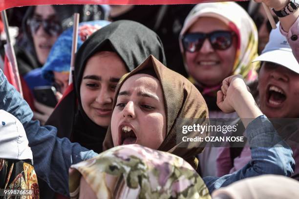 Protesters react as they listen to the speech of the Turkish President during a protest rally in Istanbul on May 18 against the recent killings of...