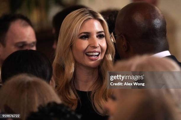 Senior adviser and daughter Ivanka Trump talks to news commentator Van Jones during a summit at the East Room of the White House May 18, 2018 in...