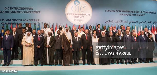 Turkish President Recep Tayyip Erdogan poses with other participants for a family photo session at the extraordinary summit of the Organisation of...