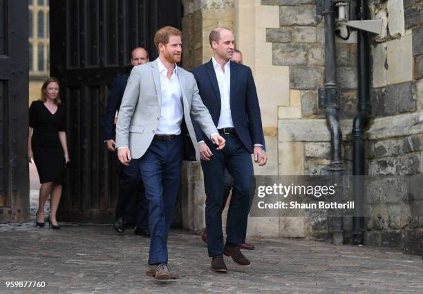 Prince Harry and Prince William, Duke of Cambridge embark on a walkabout ahead of the royal wedding of Prince Harry and Meghan Markle on May 18, 2018...