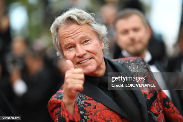 Actor John Savage poses as he arrives on May 18, 2018 for the screening of the film "The Wild Pear Tree " at the 71st edition of the Cannes Film...