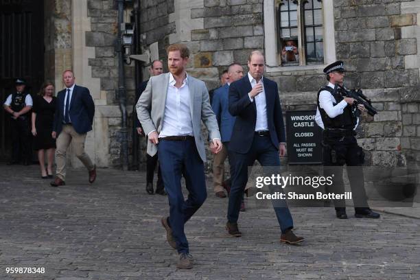 Prince Harry and Prince William, Duke of Cambridge embark on a walkabout ahead of the royal wedding of Prince Harry and Meghan Markle on May 18, 2018...