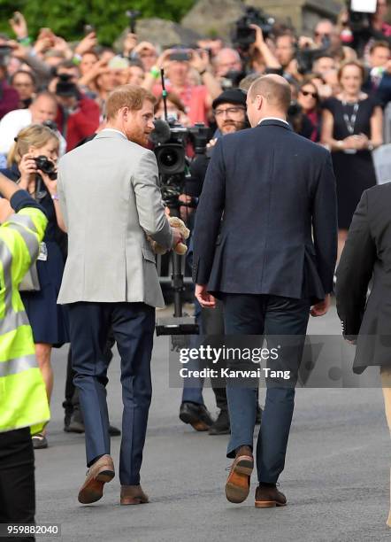 Prince Harry and Prince William, Duke of Cambridge embark on a walkabout ahead of the royal wedding of Prince Harry and Meghan Markle on May 18, 2018...