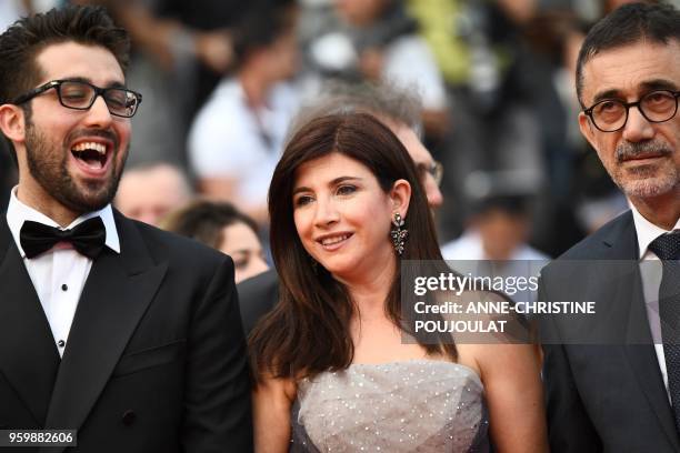 Turkish actor Aydin Dogu Demirkol, Turkish actress Ebru Ceylan and her husband Turkish director Nuri Bilge Ceylan pose as they arrive on May 18, 2018...