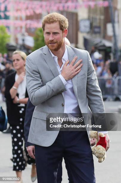 Prince Harry greets members of the public as he embarks on a walkabout ahead of the royal wedding of Prince Harry and Meghan Markle on May 18, 2018...