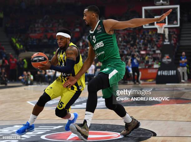 Fenerbahce's US guard Ali Muhammed fights for the ball with Zalgiris' US center Brandon Davies during the first semi-final EuroLeague Final Four...