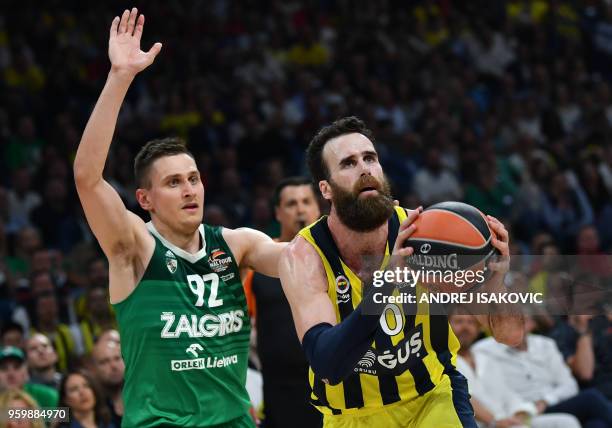 Zalgiris' Lithuanian forward Edgaras Ulanovas fights for the ball with Fenerbahce's Italian forward Luigi Datome during the first semi-final...