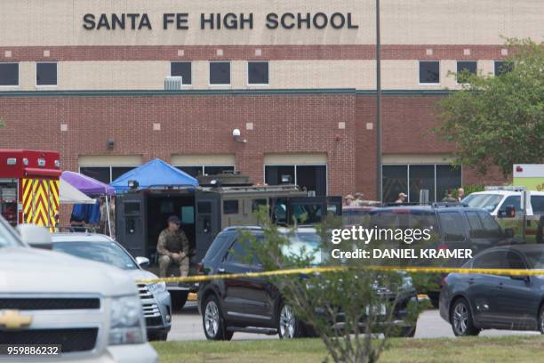 Emergency crews gather in the parking lot of Santa Fe High School where at least eight people were killed on May 18, 2018 in Santa Fe, Texas. - At...