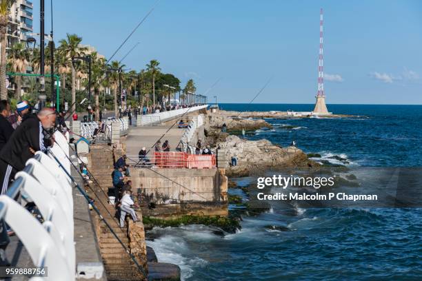 the corniche, a popular place for walking, exercise and fishing, beirut, lebanon - beiroet beach stockfoto's en -beelden