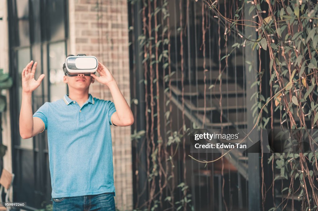 Young boy with VR headset playing and exploring