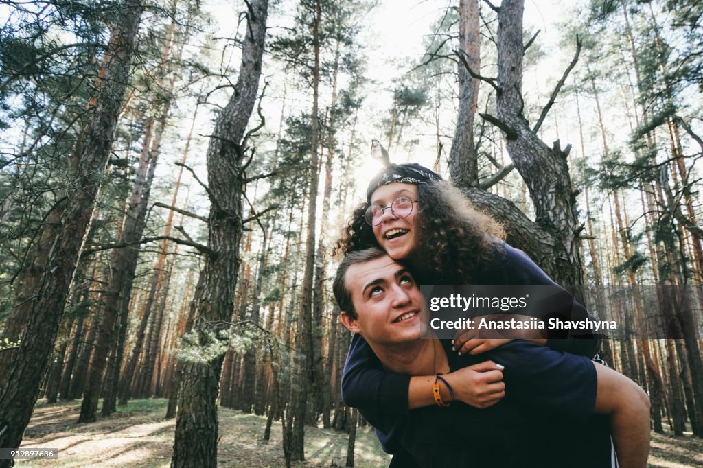 Happy young couple in the forest