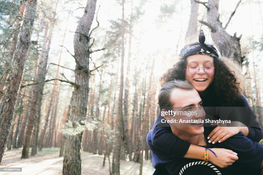 Happy young couple in the forest