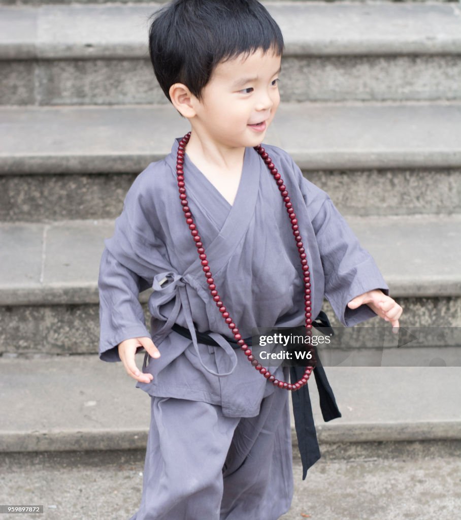 Little apprentice monk is running