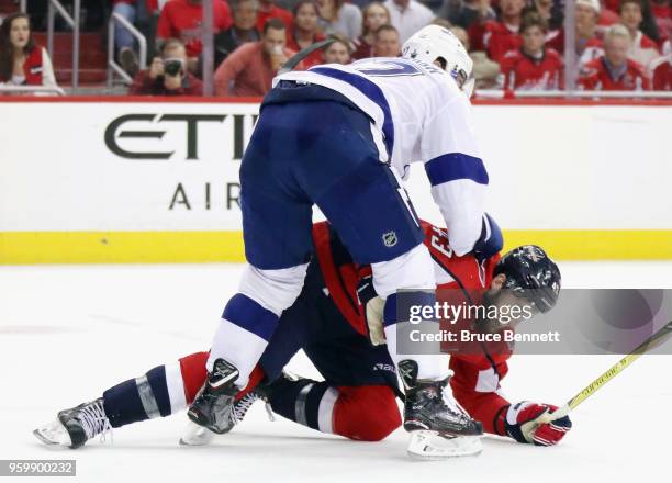 Ryan McDonagh of the Tampa Bay Lightning and Tom Wilson of the Washington Capitals battle in Game Four of the Eastern Conference Finals during the...