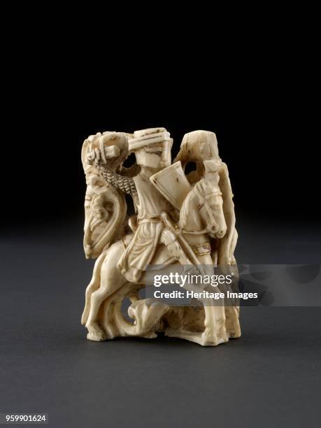 Chess-Man, 13th century. Walrus-ivory carving representing two mounted knights in combat. Dimensions: height: 7.68 cmwidth: 6.1 cm thickness: 3.8...