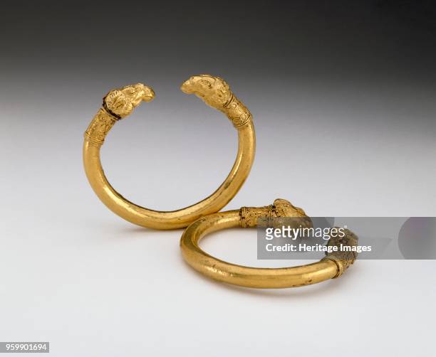 Bracelet, 5th century BC. Pair of bracelets; bronze core, but are encased in gold; terminals are in the form of ram's heads, each made in two pieces...