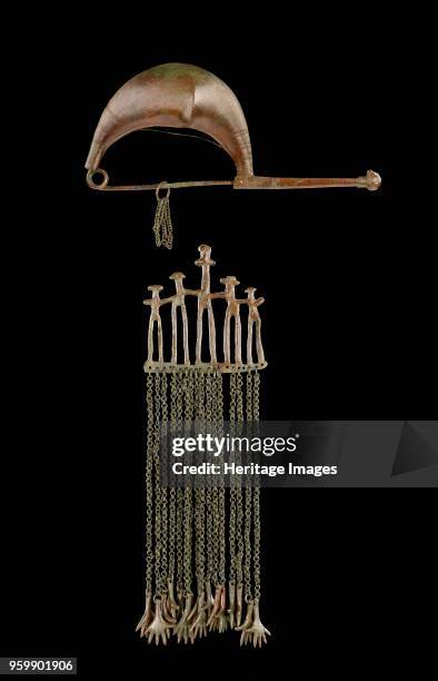 Fibula, 7th century BC. Bronze fibula; decorated with incised lines, human face at end of pin clasp. Large leech fibula, decorated with incised...