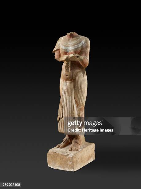 Figure of Pharaoh Akhenaten holding an offering table, XVIIIth Dynasty, circa 1540-circa 1292BC. Figure of Pharaoh Akhenaten holding an offering...