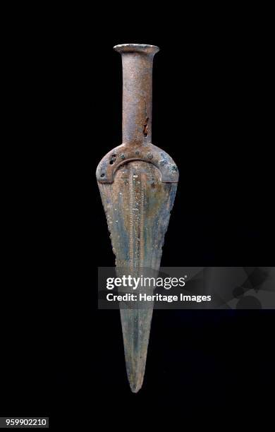 Solid-hilted dagger, Early Bronze Age , c2200BC-circa 1600 BC. Solid hilted dagger with slightly ogival blade with low flat central ribbon;...