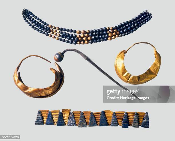Earrings, pin and necklaces, Early Dynastic, 2600-2400 BC. Including: Pair of earrings - gold, two hollow semicircles joined laterally; Silver pin...