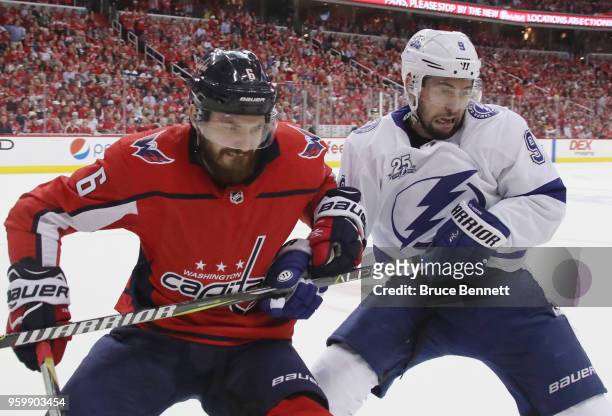 Michal Kempny of the Washington Capitals battles for position with Tyler Johnson of the Tampa Bay Lightning in Game Four of the Eastern Conference...