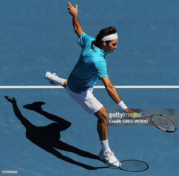 Roger Federer of Switzerland hits a volley return against Albert Montanes of Spain in their men's singles third round match on day six of the...