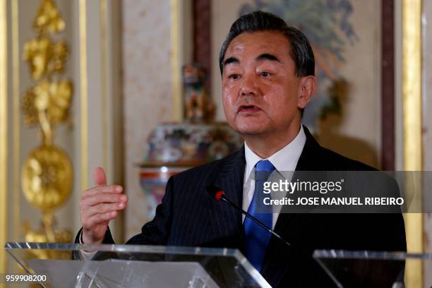 Chinese Foreign Minister Wang Yi holds a press conference with his Portuguese counterpart after their meeting at the Necessidades palace in Lisbon on...