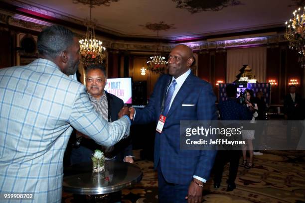 Assistant Vice President of Basketball Ops, Michael Finley shakes hands with Spencer Hayword and American civil rights activist, Jesse Jackson during...