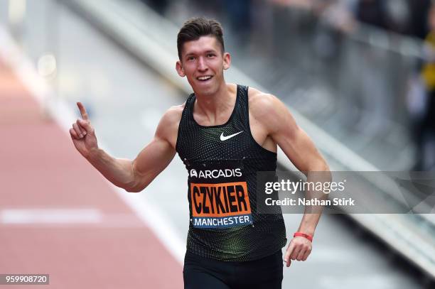 Damian Czykier of Poland celebrates after winning the mens 110 metres hurdles during the Great City Games on May 18, 2018 in Manchester, England.