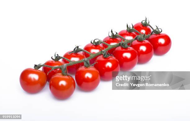 ripe fresh cherry tomatoes on branch isolated on white background - tomate freisteller stock-fotos und bilder