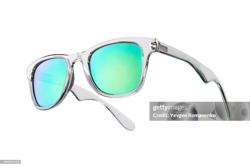 Fashionable sunglasses with green lenses. Isolated on white background